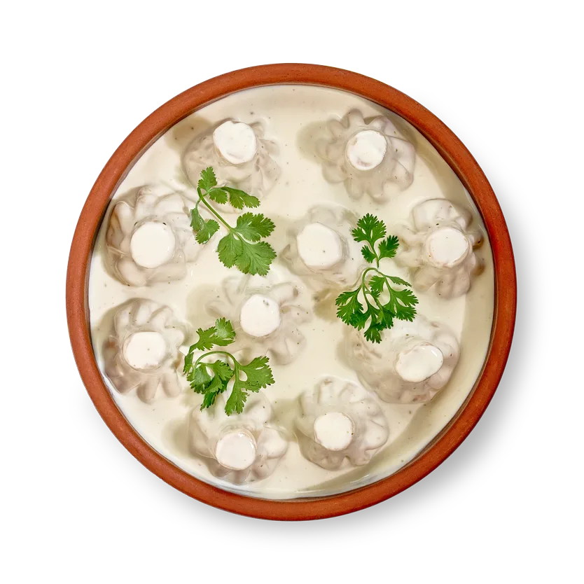 Мини-хинкали с курицей в сырном соусе